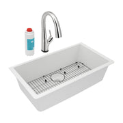 White quartz undermount sink with grid and strainer, chrome pull-down faucet, and filter cartridge.