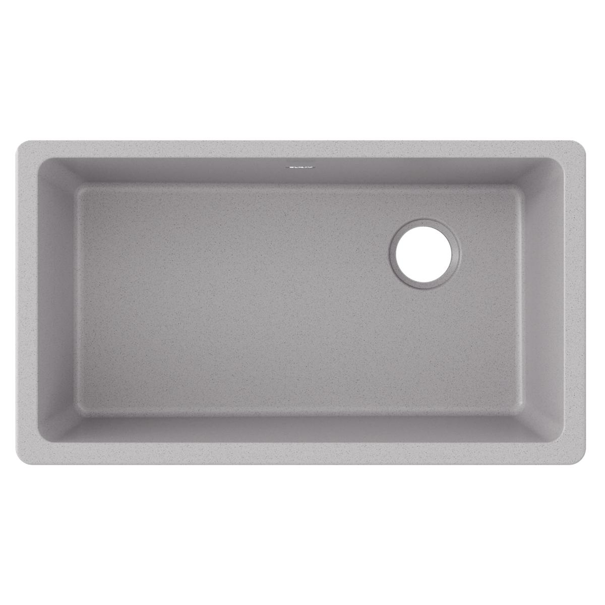 Greystone quartz single bowl undermount sink with rounded corners and drain hole on right side.
