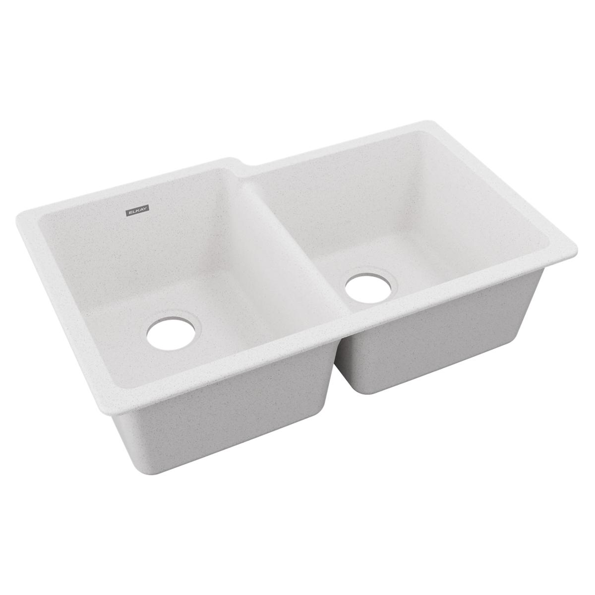 White quartz double bowl undermount sink with offset bowls and drain holes.