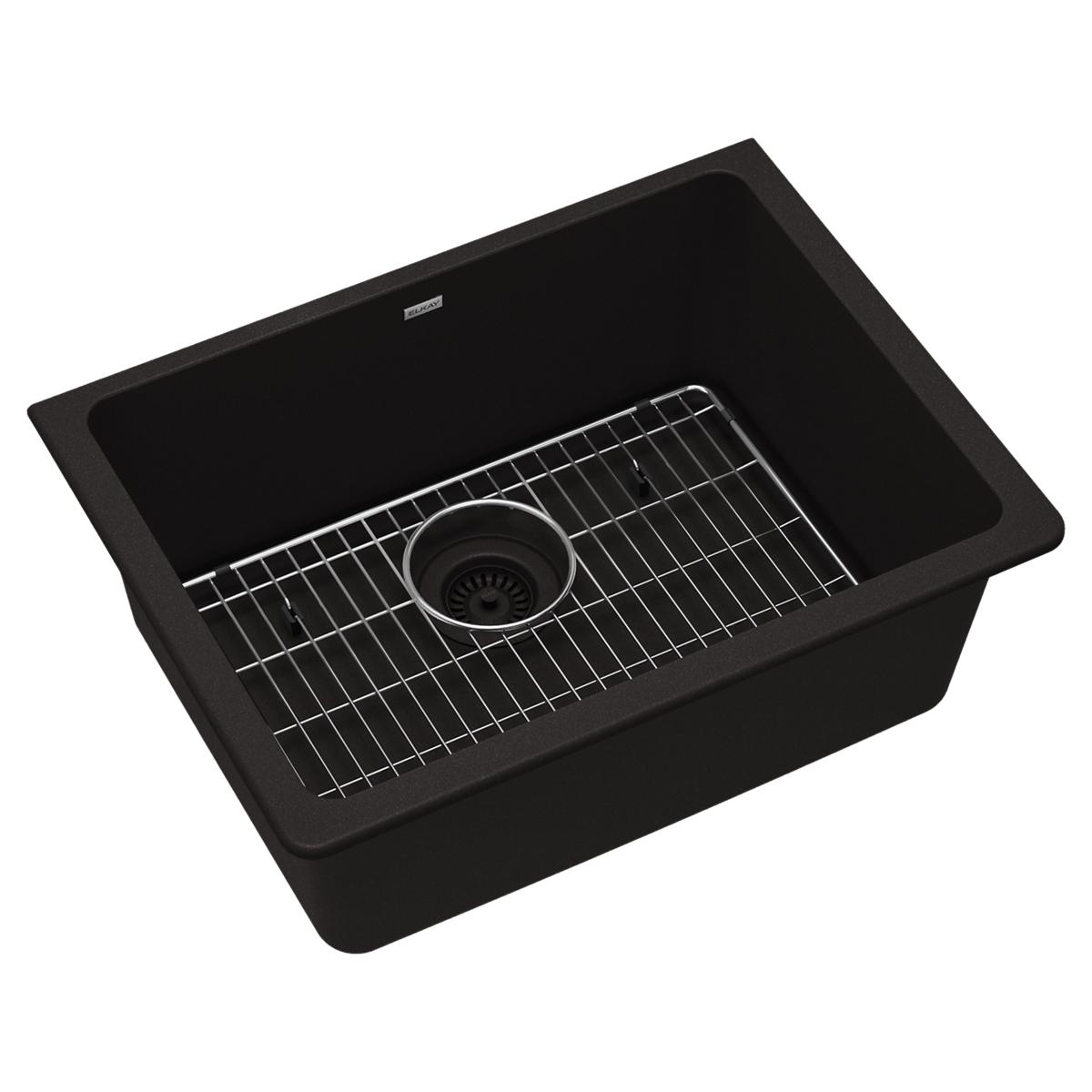 Black quartz single bowl undermount sink with stainless steel grid and drain strainer.