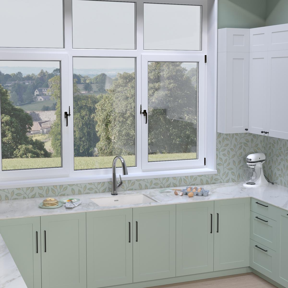 White quartz undermount sink with filtered faucet installed in green cabinetry beneath windows.