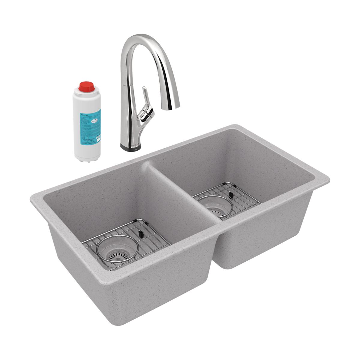 Greystone quartz double bowl undermount sink with chrome arc faucet, strainers, and water filter cartridge.