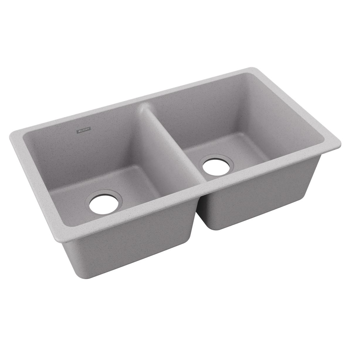 Greystone quartz double bowl undermount sink with two equal-sized basins and drain holes.