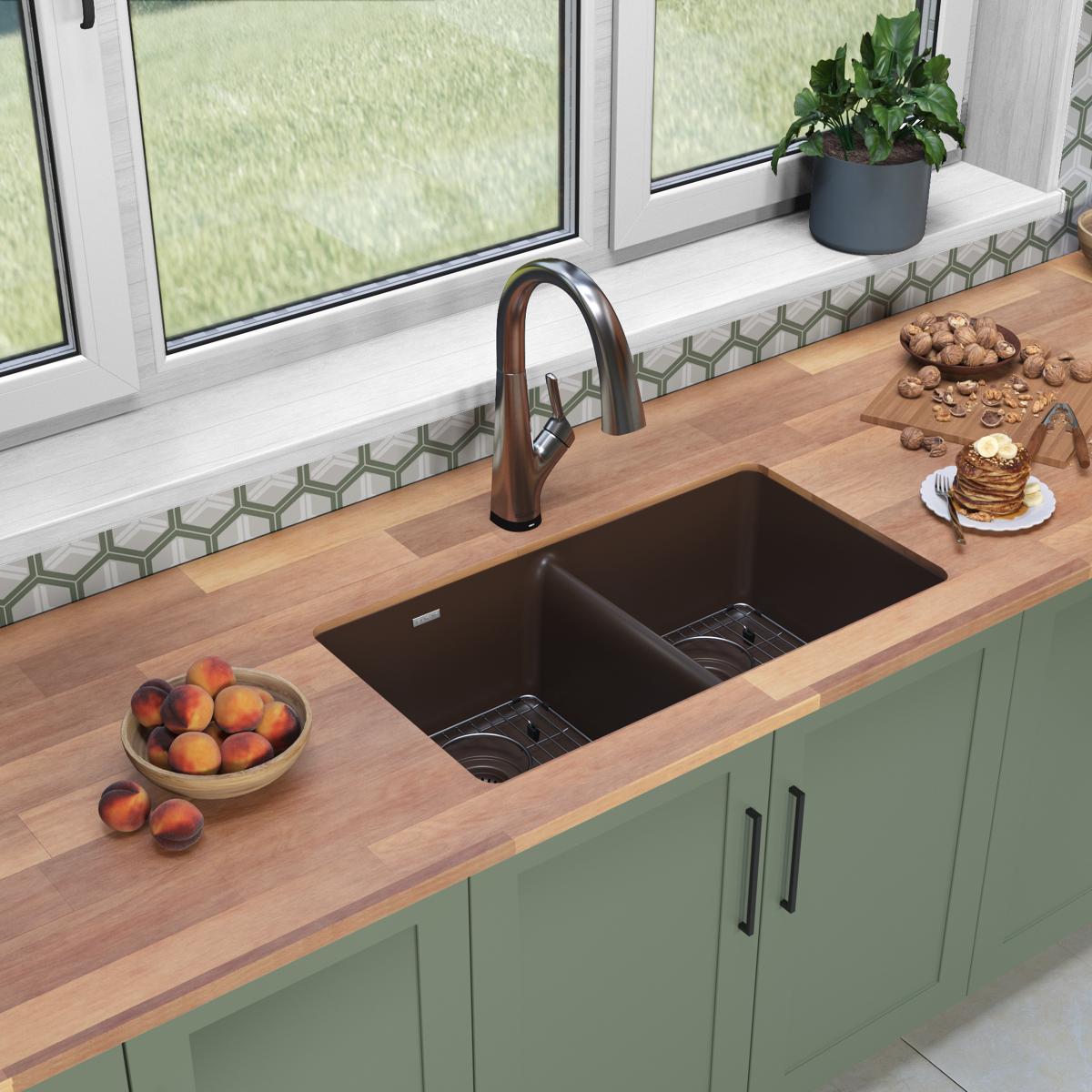 Mocha quartz double bowl undermount sink with bronze pull-down faucet installed in wooden countertop.
