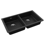Black quartz double bowl undermount sink with two drain baskets and raised rim.
