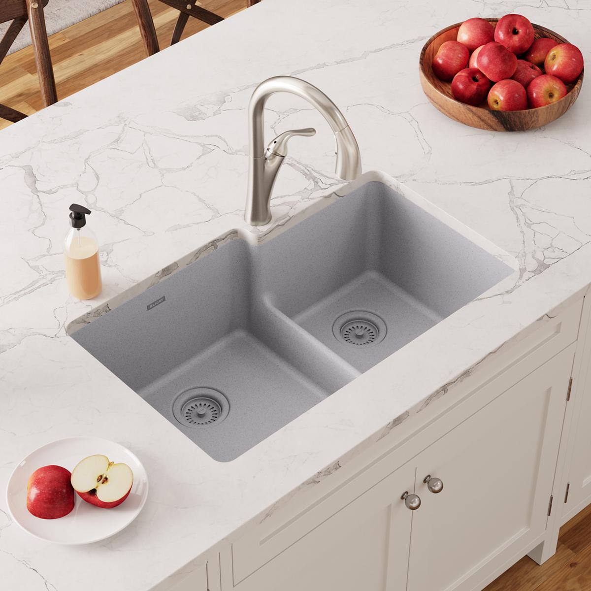 Greystone quartz double bowl undermount sink with offset 60/40 configuration and divider installed in white marble countertop