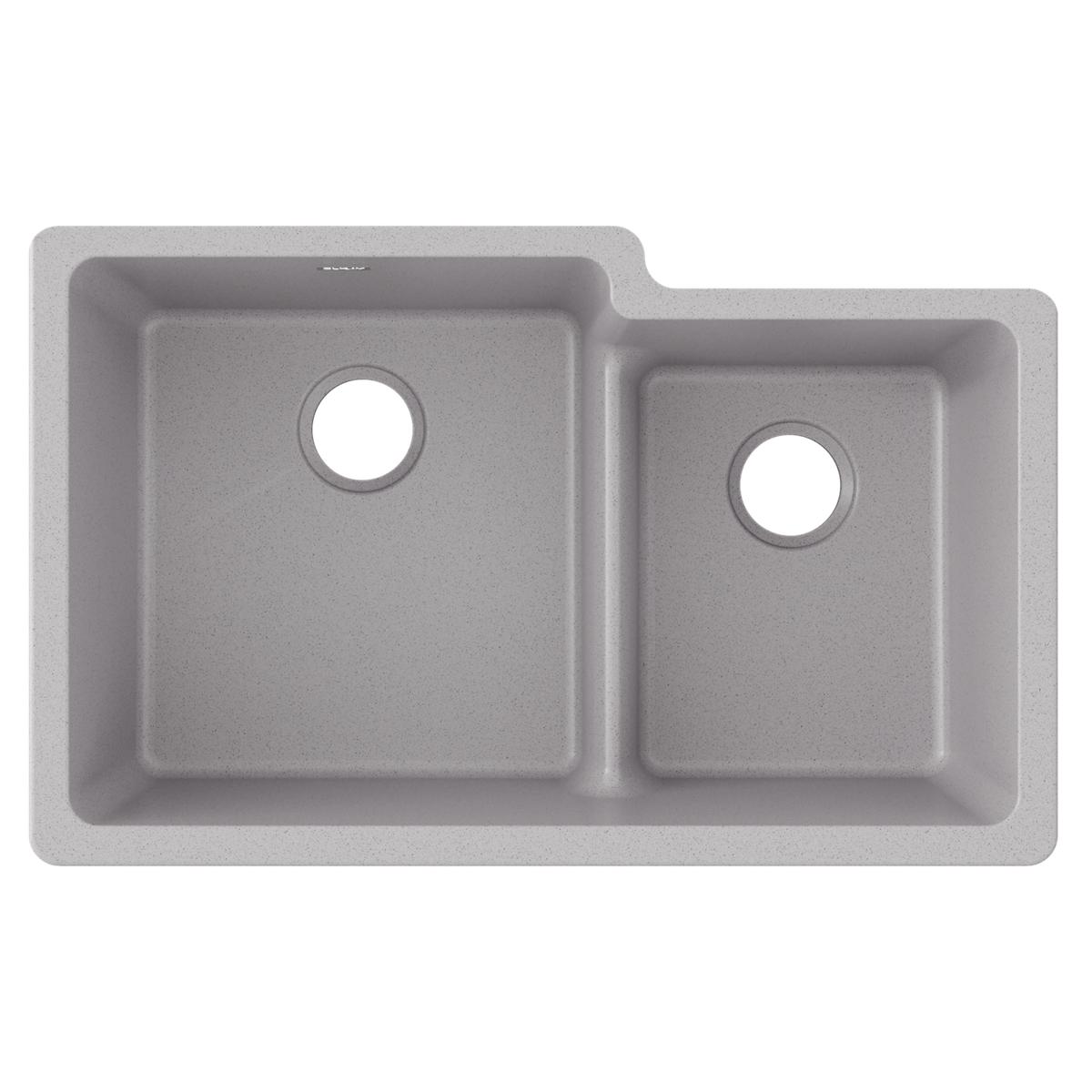 Greystone quartz double bowl undermount sink with larger left basin and smaller right basin, each with drain opening.