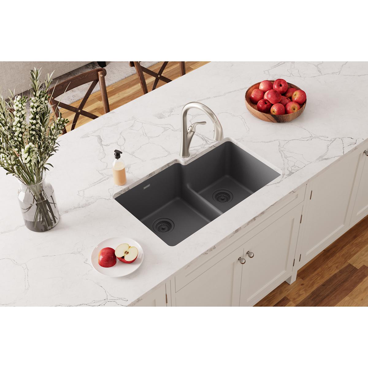 Dusk gray quartz double bowl undermount sink with divider installed in white marble countertop.