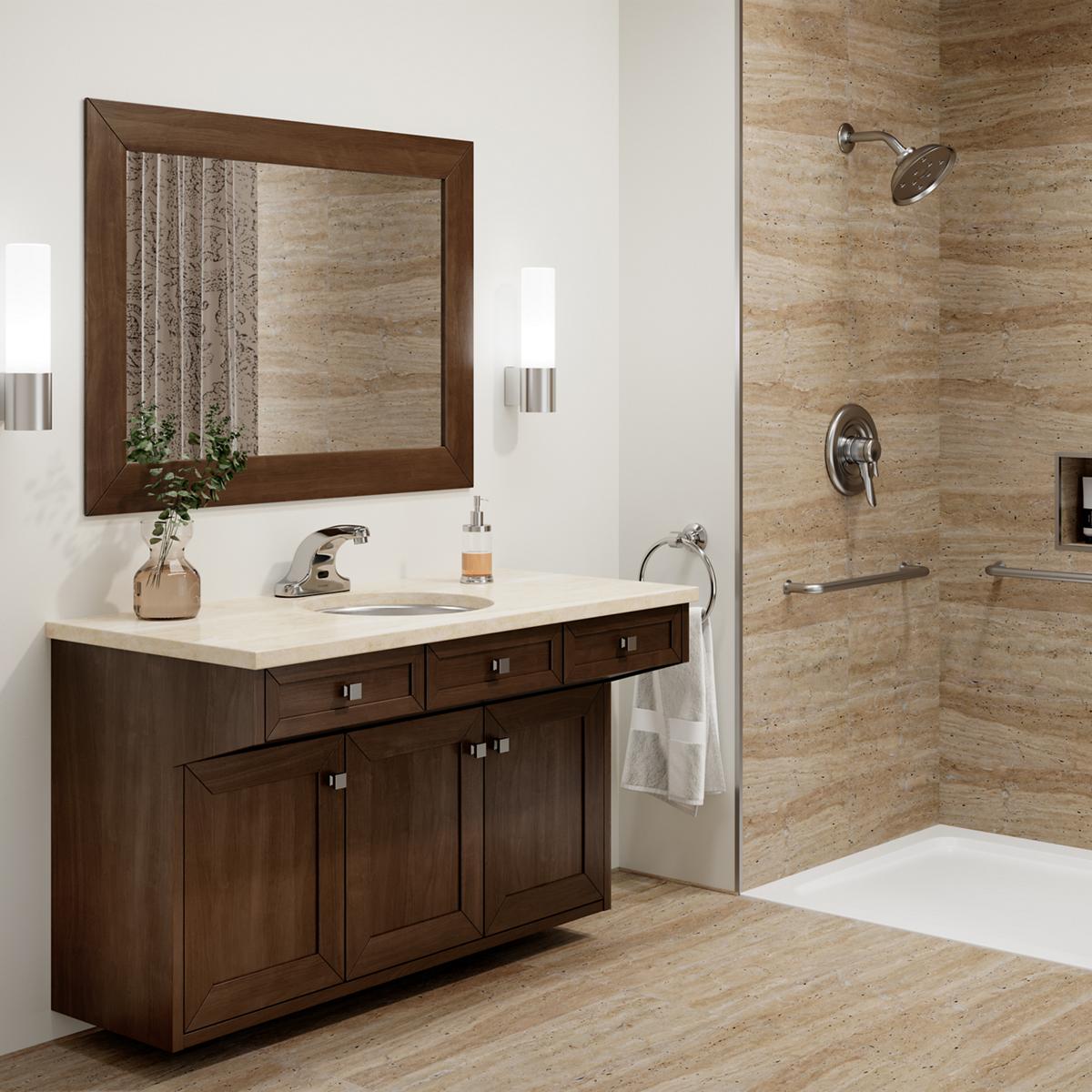 Stainless steel square undermount bathroom sink installed in cream countertop on dark wood vanity cabinet.