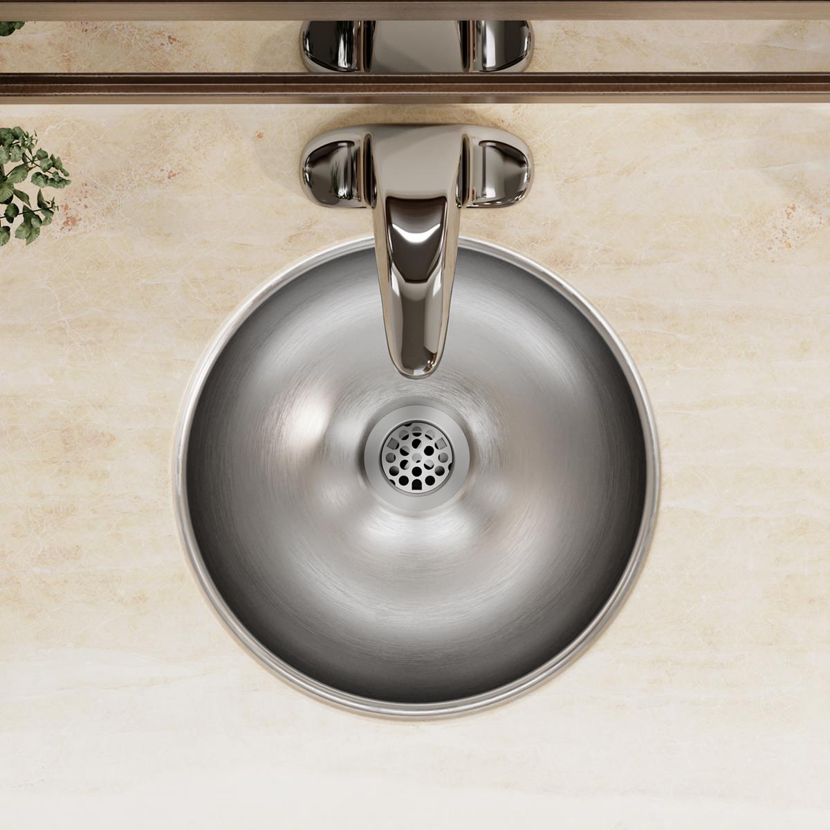 Stainless steel circular bathroom sink with single bowl, drain hole, and chrome faucet mounted underneath marble countertop.