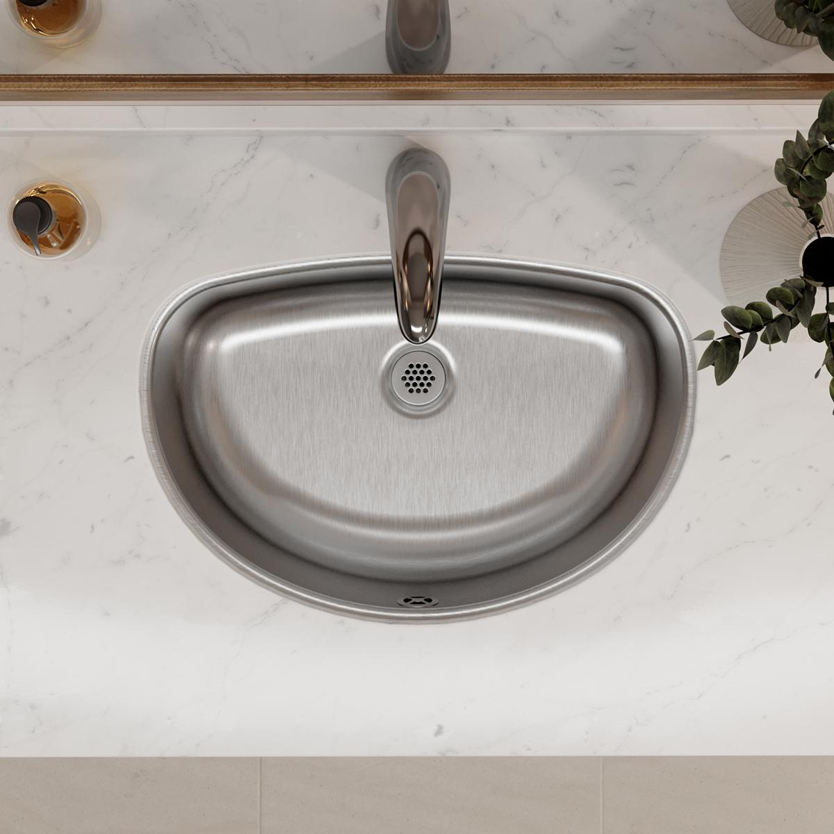 Stainless steel undermount bathroom sink with oval bowl and drain, installed in marble countertop.