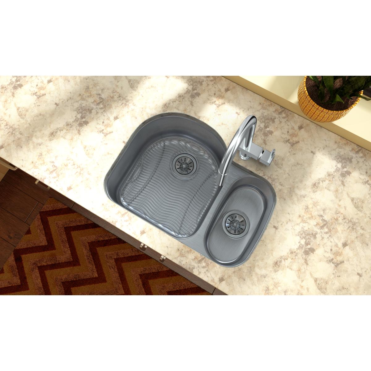 Stainless steel sink bottom grid with parallel ridges installed in double basin sink.