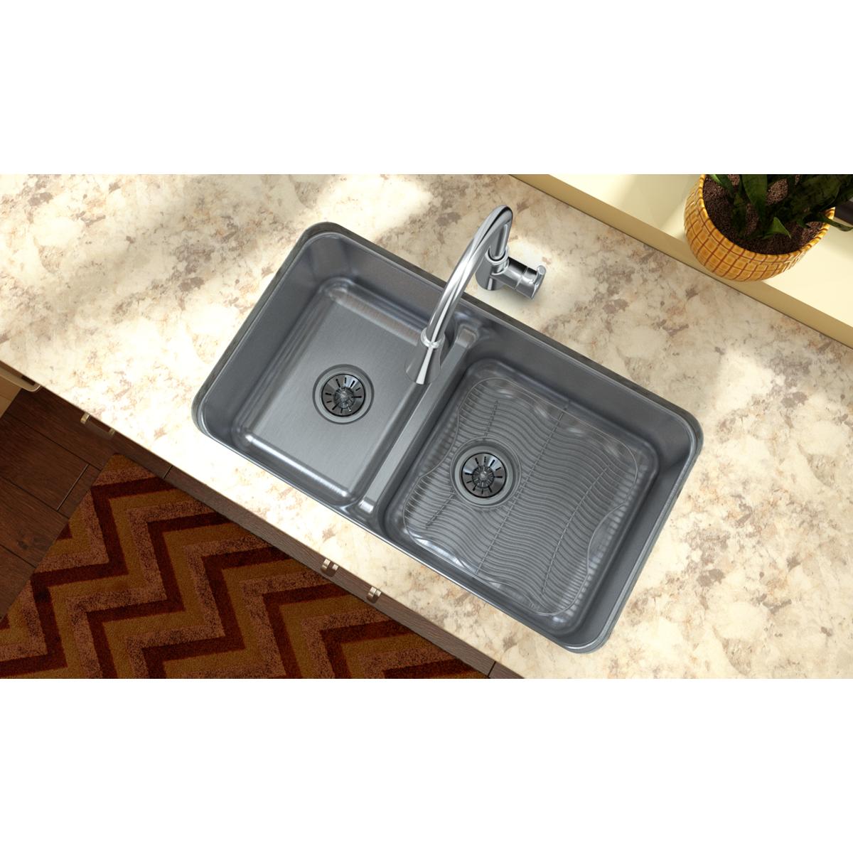 Stainless steel sink grid with raised ribs, designed to fit in sink basin for dish protection.