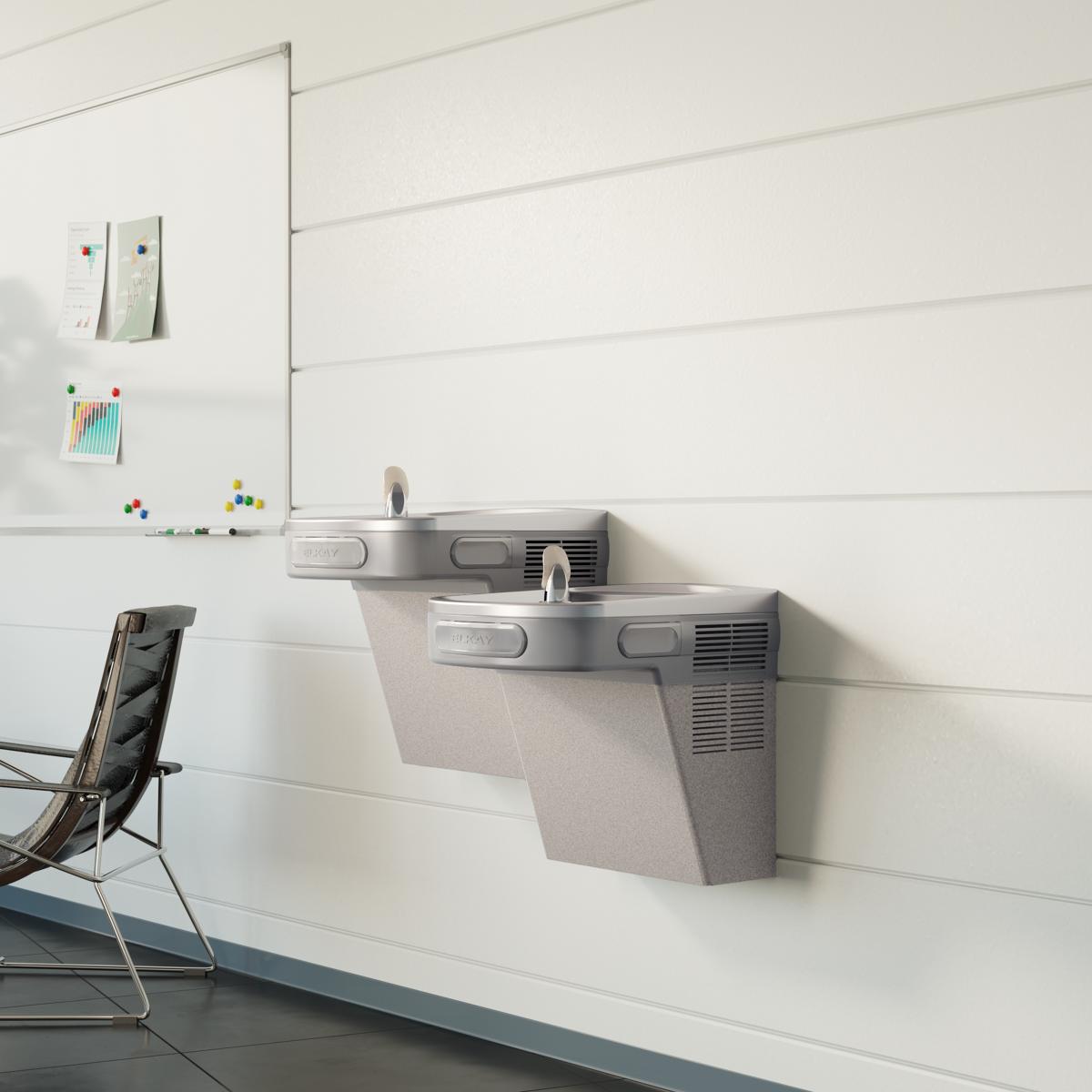 Light gray granite wall-mounted dual-level water cooler with drinking fountains at different heights.