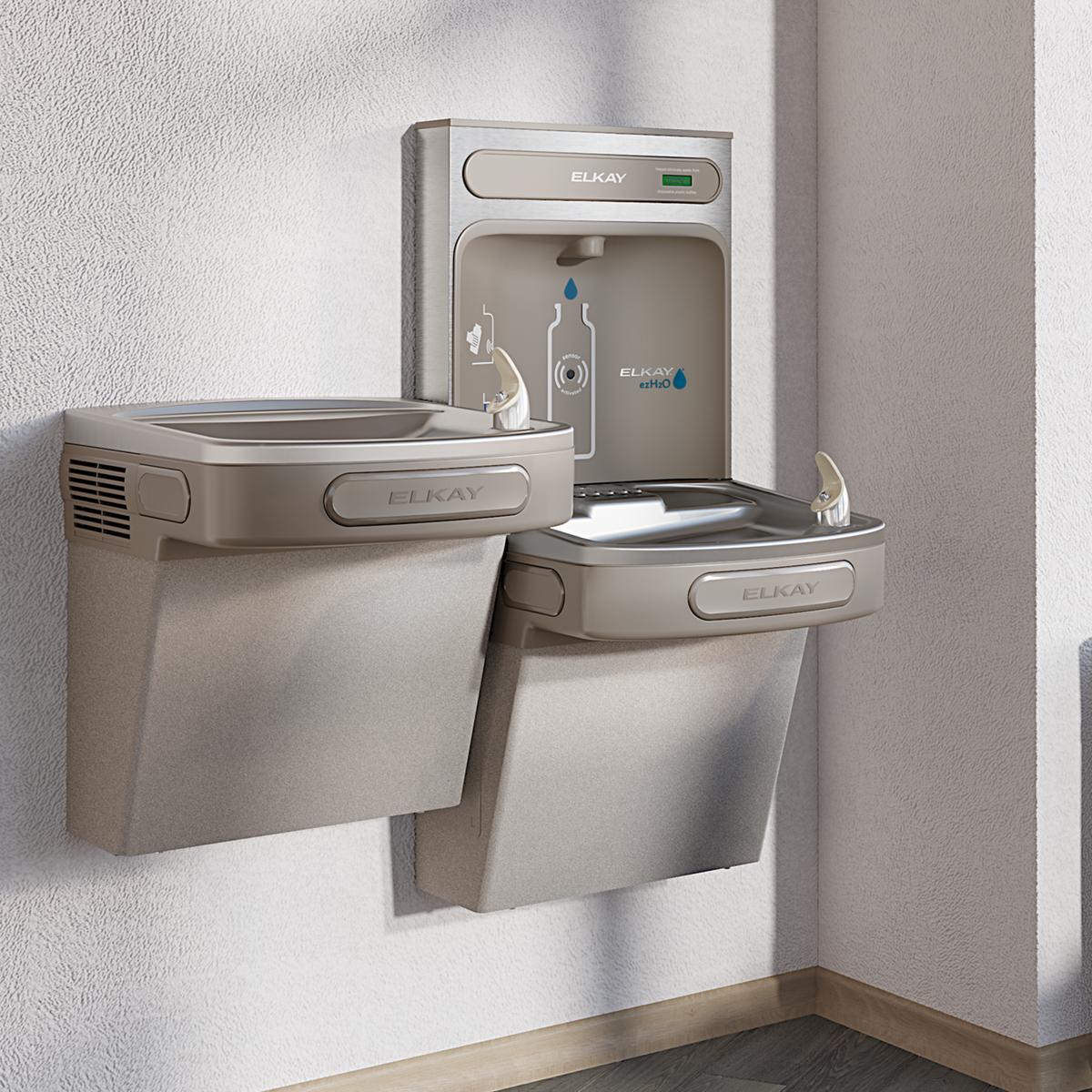 Light gray Elkay water cooler with dual drinking fountains at different heights and bottle filling station mounted on wall.