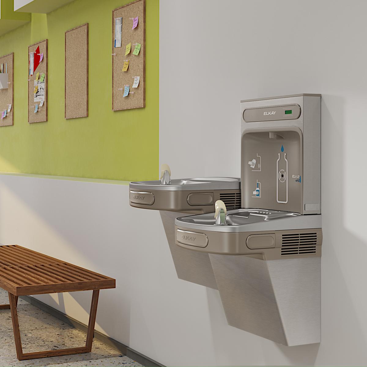 Stainless steel wall-mounted water cooler with dual drinking fountains at different heights and bottle filling station above,