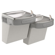 Wall-mounted bi-level water cooler with two basins and foot pedals in light gray granite finish.