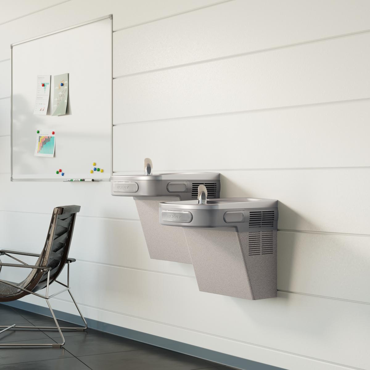 Wall-mounted light gray granite bi-level water cooler with two drinking fountains and control buttons.