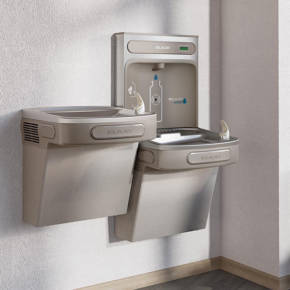 Light gray Elkay bi-level water station with upper bottle filling dispenser and two lower drinking fountains mounted on wall.