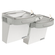Stainless steel wall-mounted water cooler with two drinking fountains at different heights and chrome faucets.