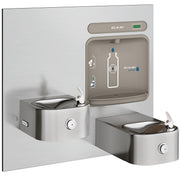 Stainless steel wall-mounted water fountain with bottle filling station and two curved drinking basins with foot pedals.