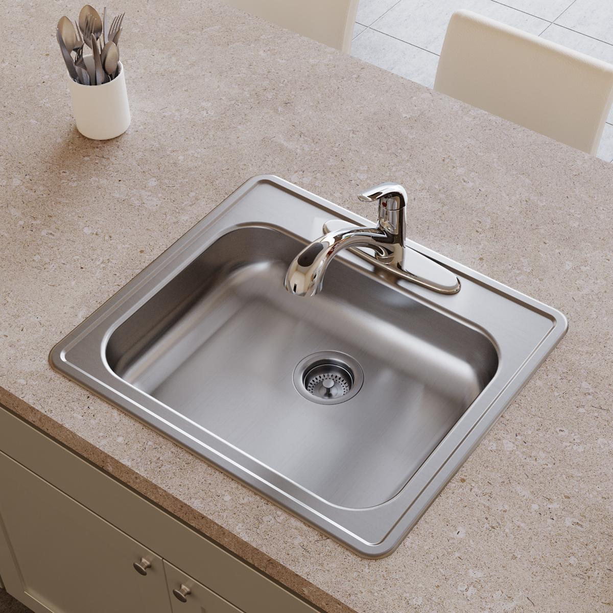 Stainless steel single bowl drop-in sink with chrome faucet and drain strainer installed in countertop.