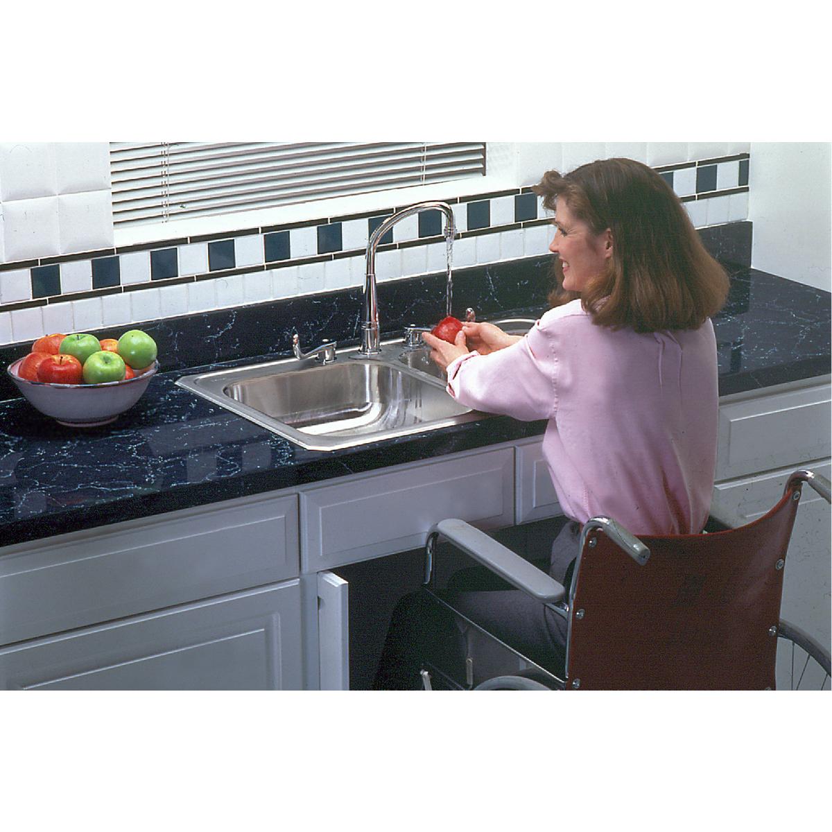 Stainless steel double bowl drop-in sink installed in black countertop with chrome faucet and single hole.