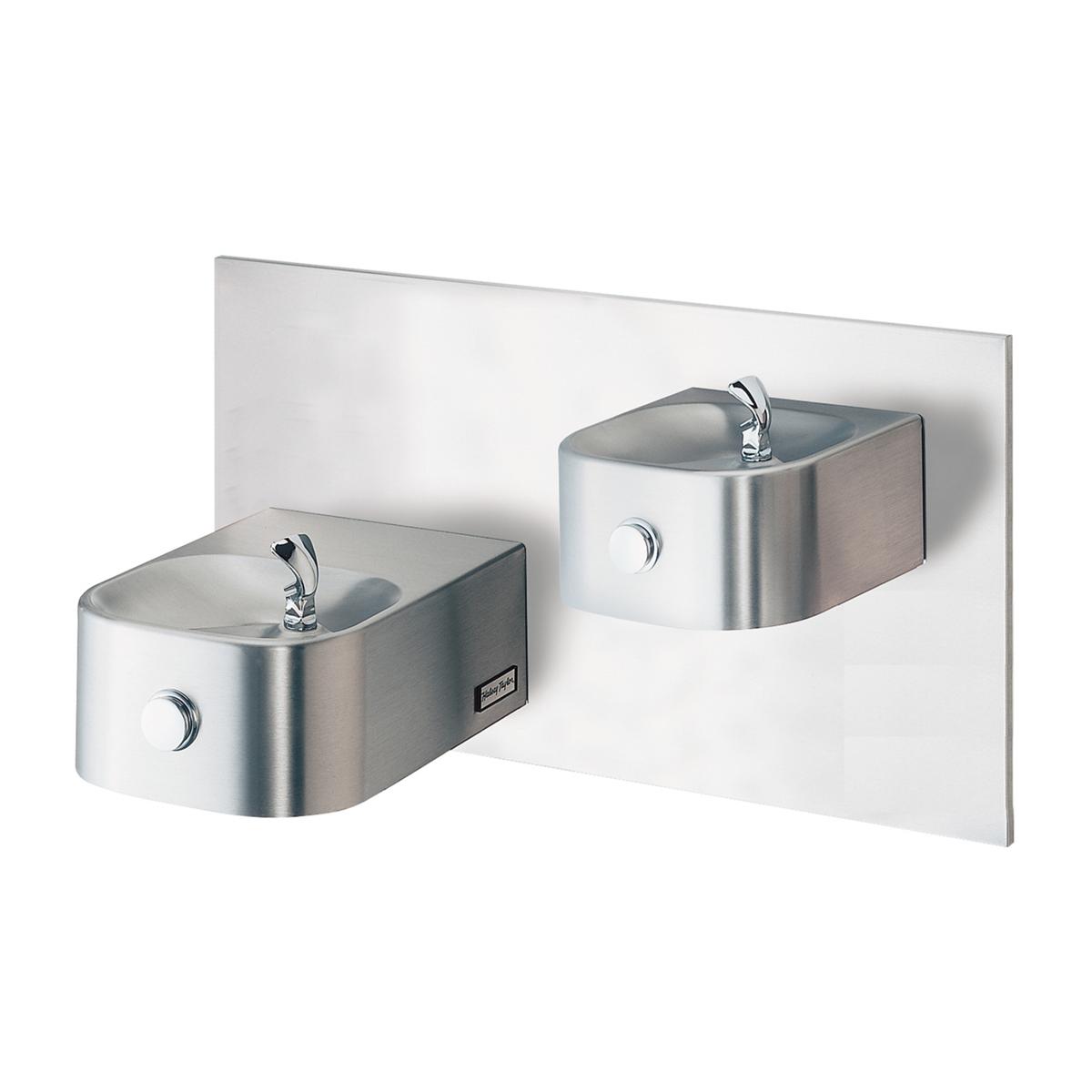 Stainless steel dual water fountains mounted on white panel with chrome faucets and circular control buttons.