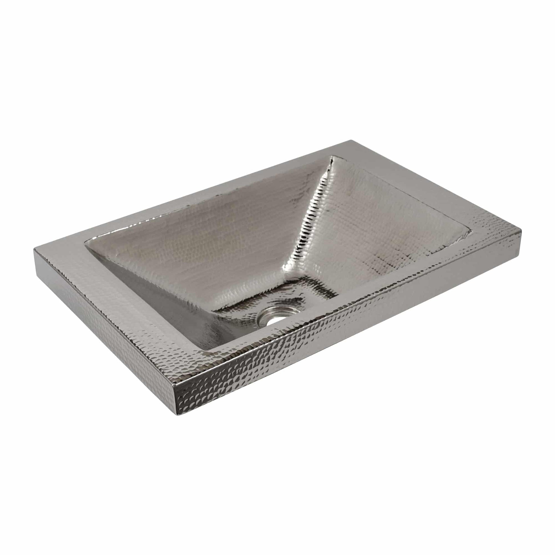 Polished nickel rectangular sink with hammered texture and single drain opening.