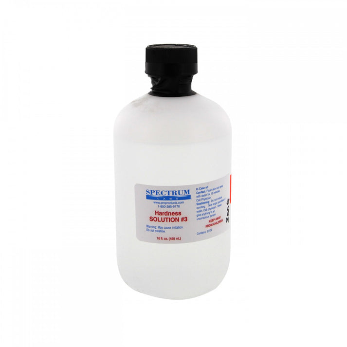 Clear plastic bottle with black cap containing Spectrum Hardness Solution #3 water treatment liquid, 16 fluid ounces.
