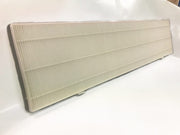 Rectangular pleated air filter with white accordion-style pleats and gray frame, shown at an angle on white surface.
