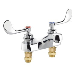 Chrome medical faucet with two lever handles and brass inlet connections on white background.