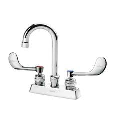 Chrome deck-mount faucet with curved gooseneck spout and two wristblade handles on white base.