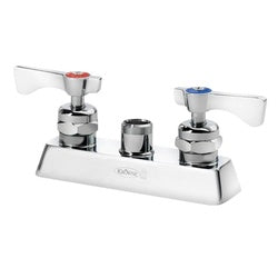 Chrome deck mount faucet with 4-inch center spacing, two handles, and integrated sprayer on white base.