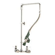 Chrome pre-rinse faucet with solid arm, green trigger spray head, and floor-mounted base.
