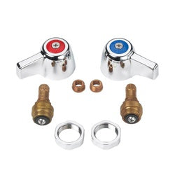 Compression repair kit with red and blue knob handles, brass valve bodies, copper seats, and metal rings arranged on white ba