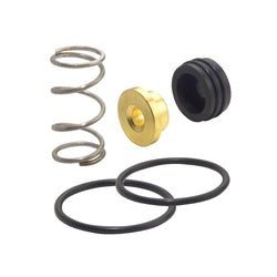 Metal spring, brass fitting, and black rubber o-rings and seals arranged on white background.