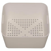 White plastic square floor drain strainer with perforated top and deep basin.