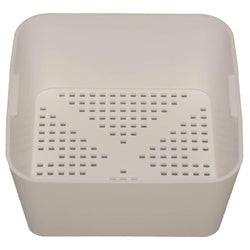 White plastic square floor drain strainer with perforated top and deep basin.