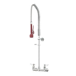 Wall-mounted pre-rinse faucet with coiled spray hose, red handle, and dual base knobs on white background.