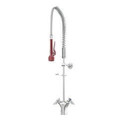 Tall stainless steel pre-rinse faucet with coiled hose and red handle valve on deck mount base.