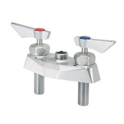 Chrome deck mount faucet base with two wide handles and cylindrical mounting legs on white platform.