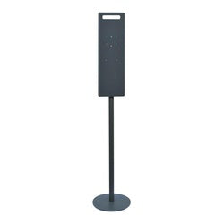 Floor stand with dark back plate and round base for liquid soap or sanitizer dispenser.
