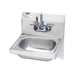 Stainless steel drop-in sink with single compartment, chrome faucet with sprayer, and mounted drain assembly.