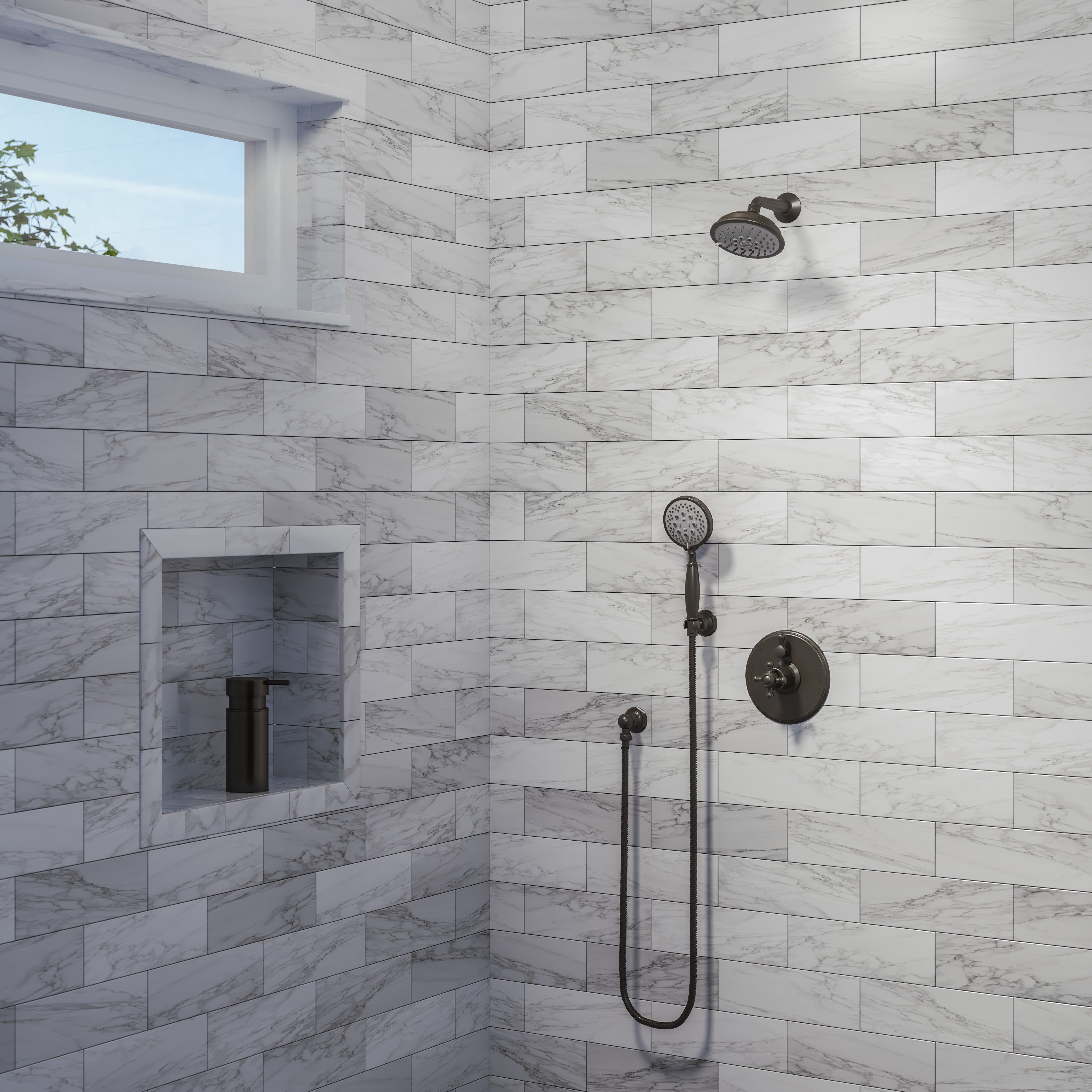 Polished chrome showerhead with traditional design mounted on marble tile shower wall alongside handheld spray fixture.