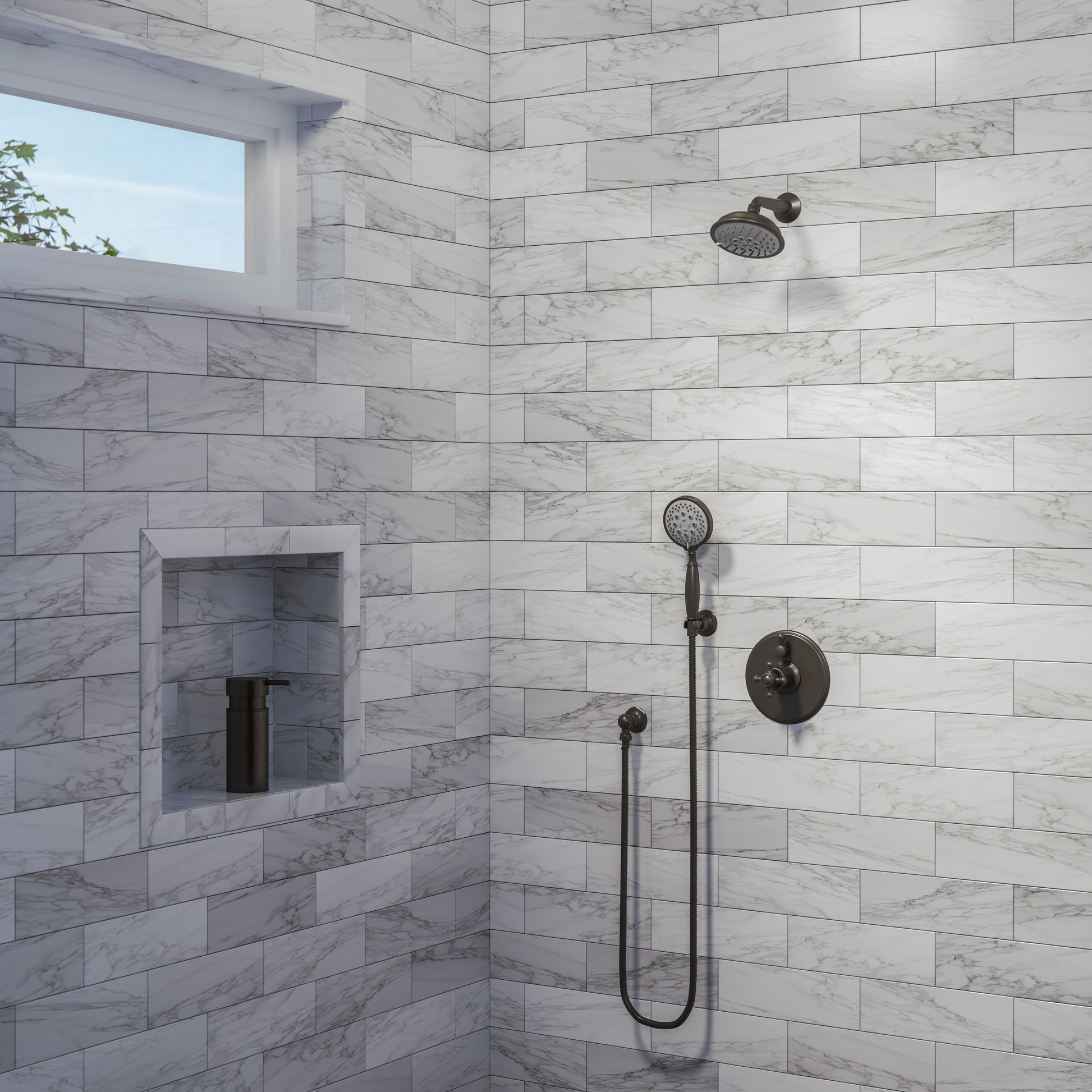 Bronze traditional showerhead mounted on marble tile wall with hand shower and control valve visible.