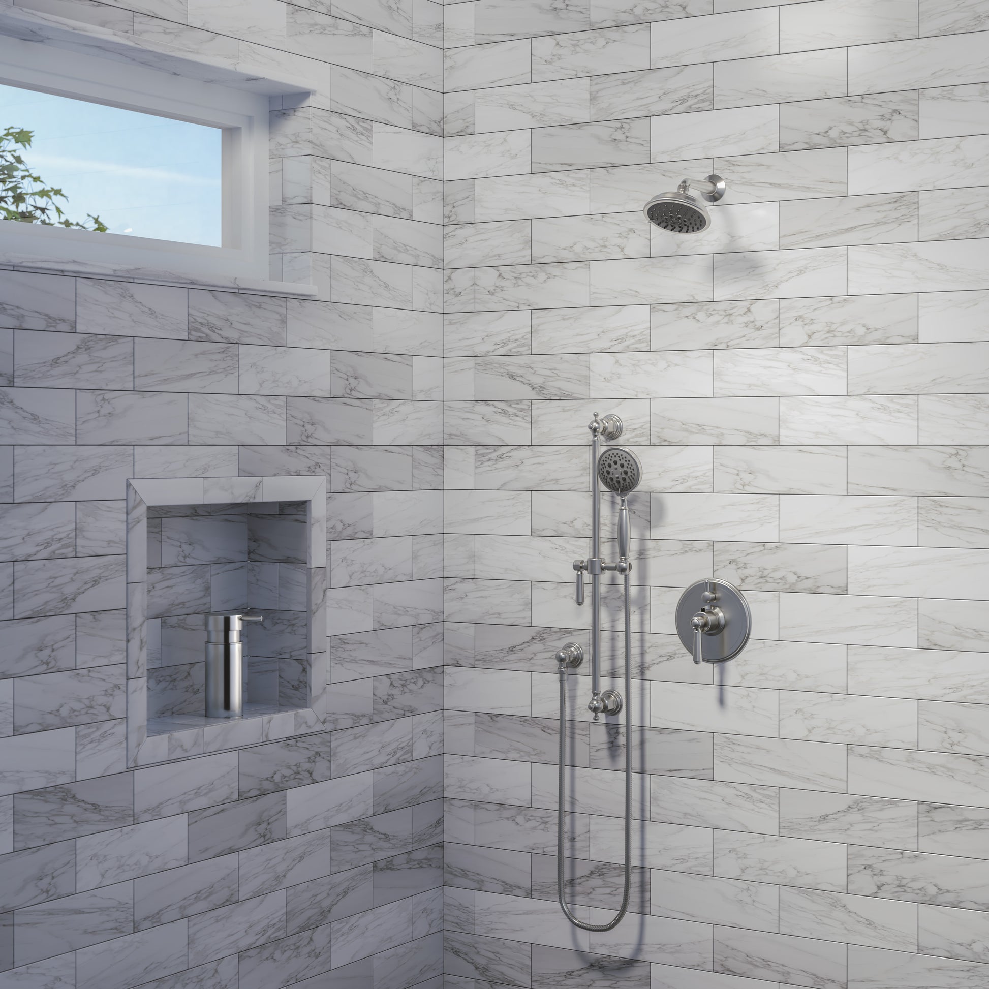 Round brushed metal showerhead mounted on marble tile bathroom wall with valve controls and handheld spray attachment.