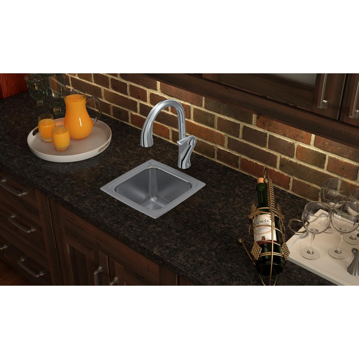 Stainless steel square drop-in sink with single bowl installed in dark countertop, chrome faucet visible above.
