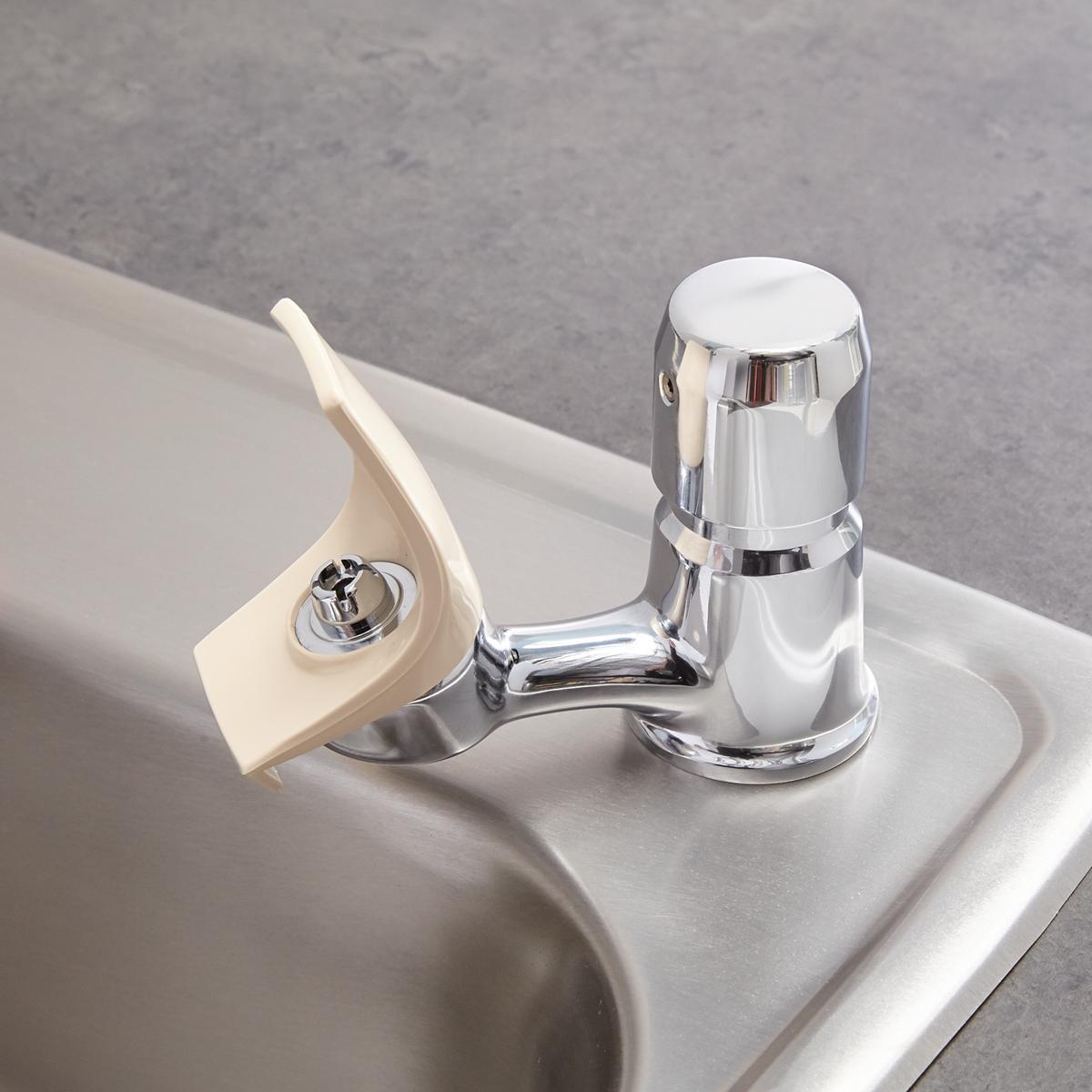 White and chrome water fountain bubbler with flexible guard arm mounted on white sink basin.