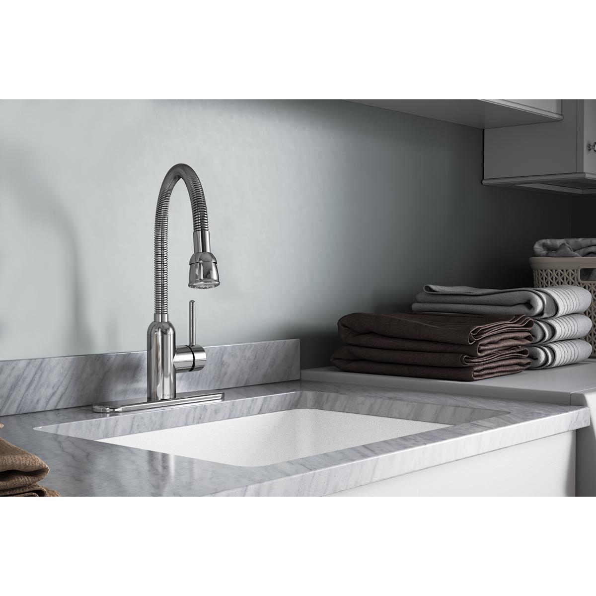 Chrome laundry faucet with flexible hose spout and single forward lever handle installed above white utility sink.